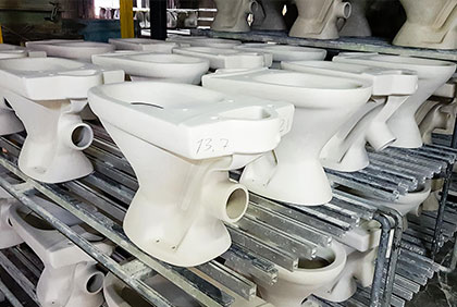 Pressure casting of toilet bowls